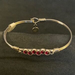 Luca & Danni  Silver Tone Bangle Bracelet with Red Gem Accents